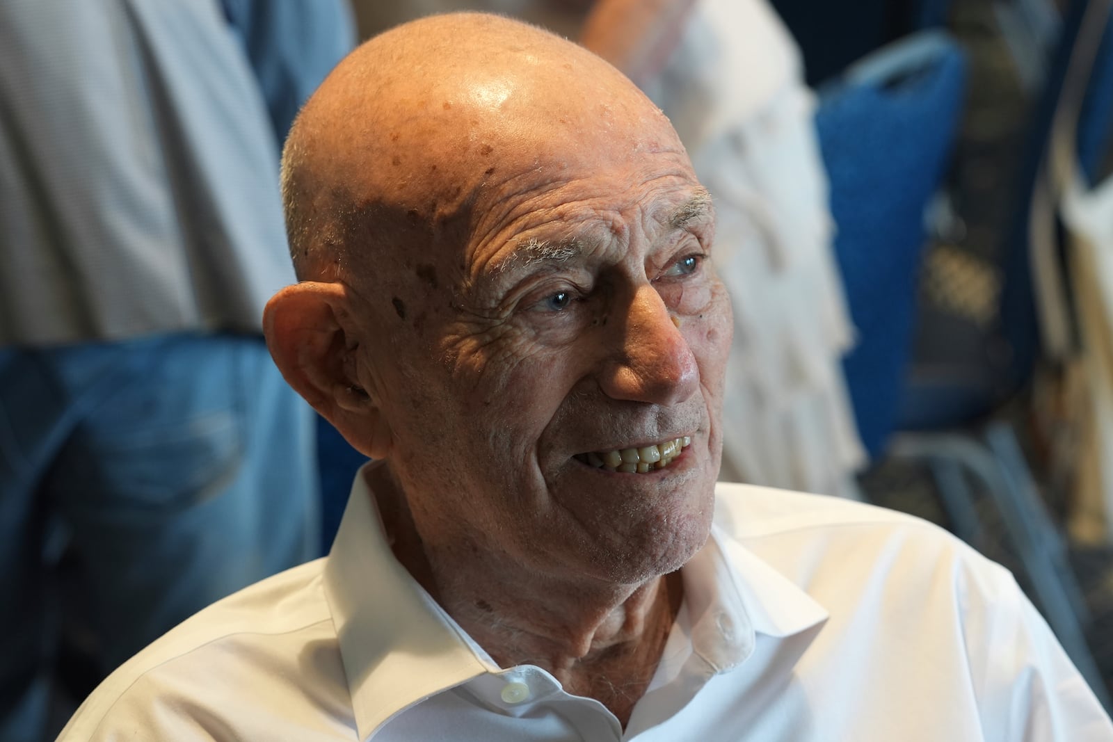 Harold Terens, a World War II veteran who fought in D-Day, speaks to friends during his 102 birthday party Saturday, July 26, 2025, in Delray Beach, Fla. (AP Photo/Marta Lavandier)