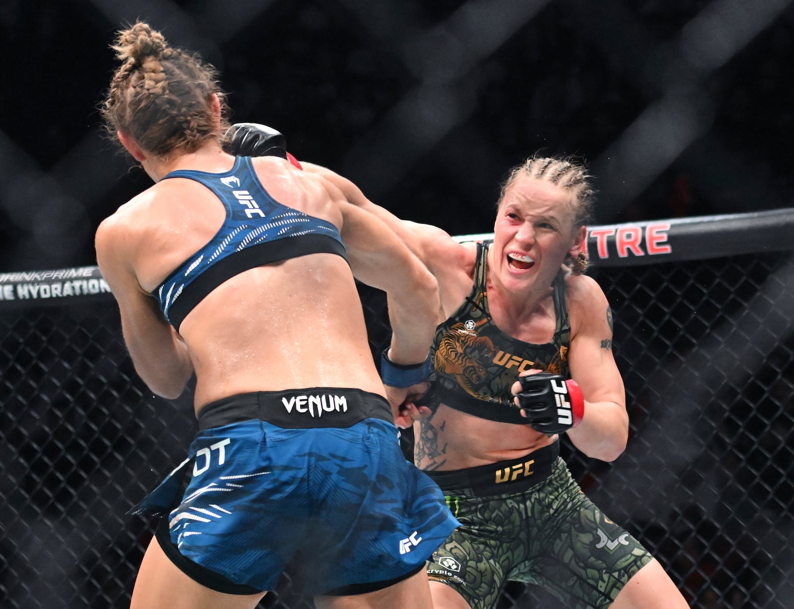 Valentina Shevchenko, right, lands a blow to Manon Fiorot during their UFC 315 mixed martial arts flyweight title bout in Montreal, Saturday, May 10, 2025. (Graham Hughes/The Canadian Press via AP)