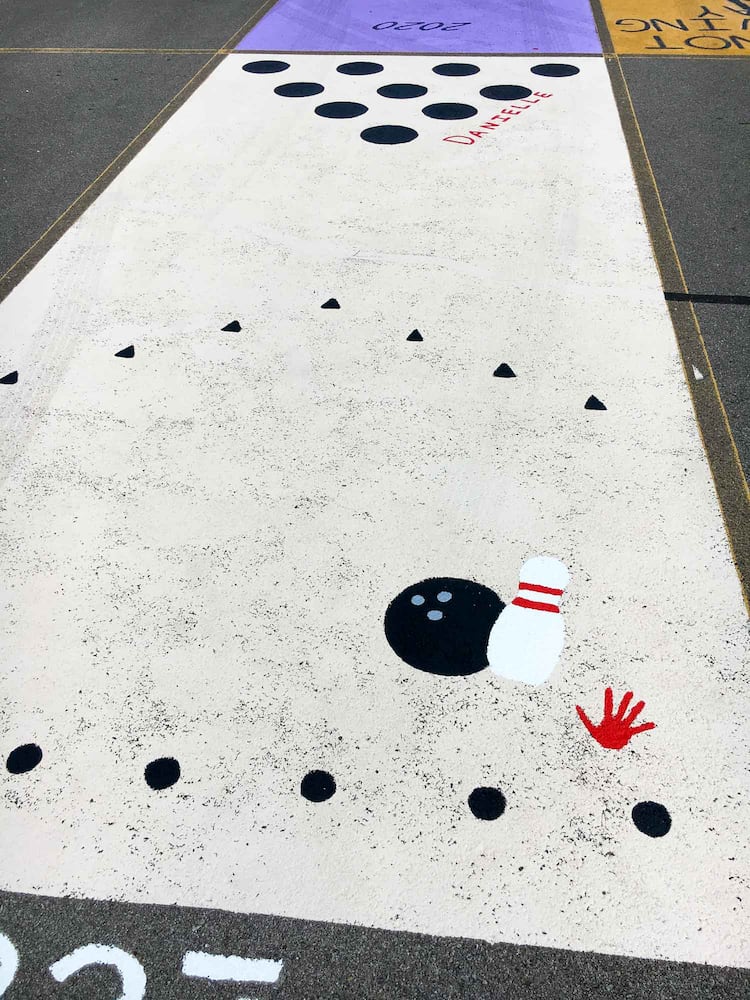 PHOTOS Lakota East seniors paint parking spots