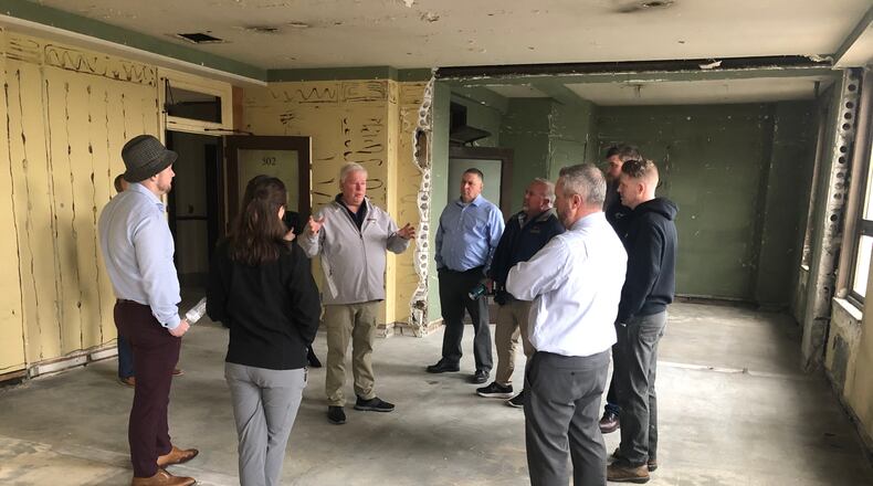 Developer Steve Coon, center, talks to Middletown City Council members, city staff and members of the Historic Commission during a special meeting Tuesday afternoon. Coon wants to build apartments and convert the first floor into retail space. RICK McCRABB/STAFF