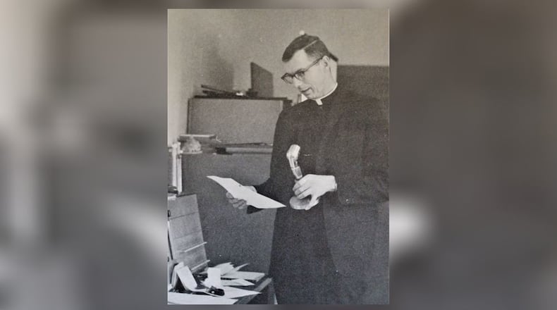Former Fenwick High School Principal James J. O’Connor’s legacy of leading the Middletown high school during its boom years of the late 1960s and early 1970s helped lead to the school’s modern-day success. The Rev. O’Connor, who died May 4 at the St. Charles Center in Celina, Ohio, was instrumental in shepherding the Catholic Middletown school through some of its most transformational years, said Fenwick school officials. O'Connor pictured here in undated photo from the late 1960s making an announcement to Fenwick's students and staff. CONTRIBUTED