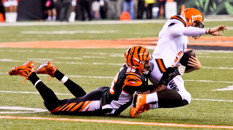 Cincinnati Bengals defensive end Carlos Dunlap sacks Cleveland Browns quarterback Johnny Manziel during the Bengals' 31-10 victory Thursday, Nov. 5 at Paul Brown Stadium in Cincinnati. The Bengals are now 8-0 on the season. NICK GRAHAM/STAFF