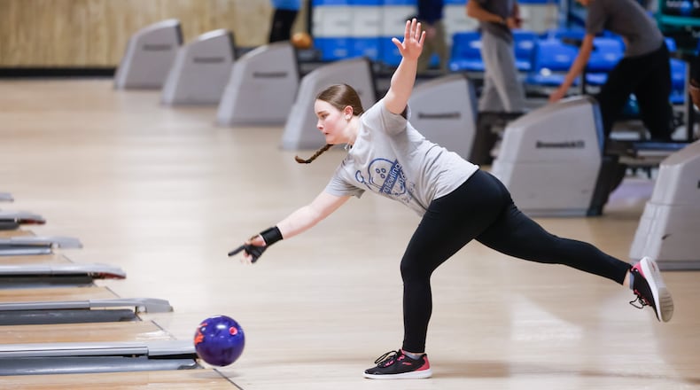 Addison Hoelscher, a junior at Lakota West High School, carries a 188.2 average, tying her for the highest in the Greater Miami Conference. She and her teammates practiced this week at Gilmore Lanes in Fairfield. NICK GRAHAM/STAFF