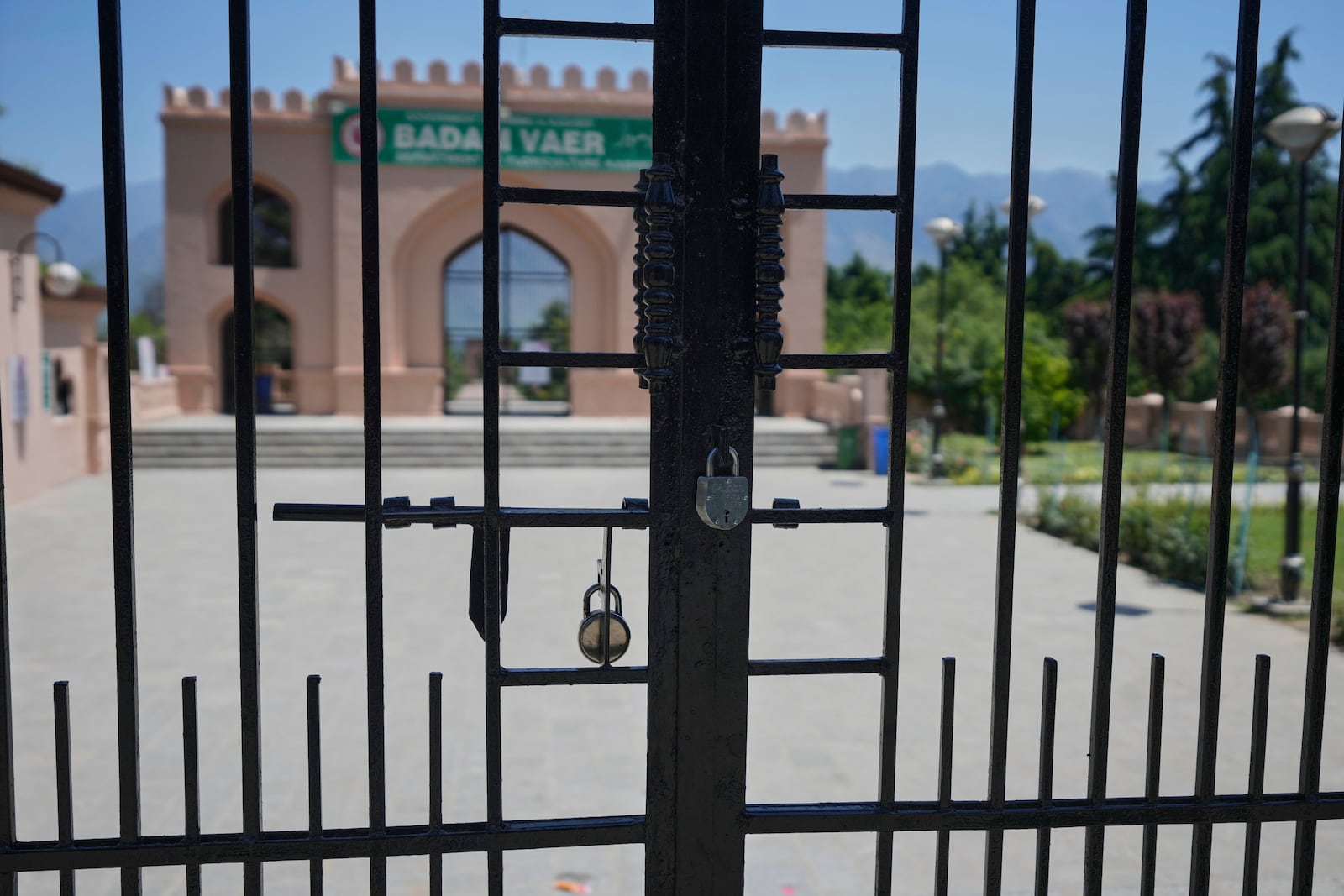 A locked garden gate is seen in Srinagar after it was closed by authorities as a precautionary safety measure following last week's deadly attack on tourists near the resort town of Pahalgam, Indian controlled Kashmir, Tuesday, April 29, 2025. (AP Photo/Mukhtar Khan)