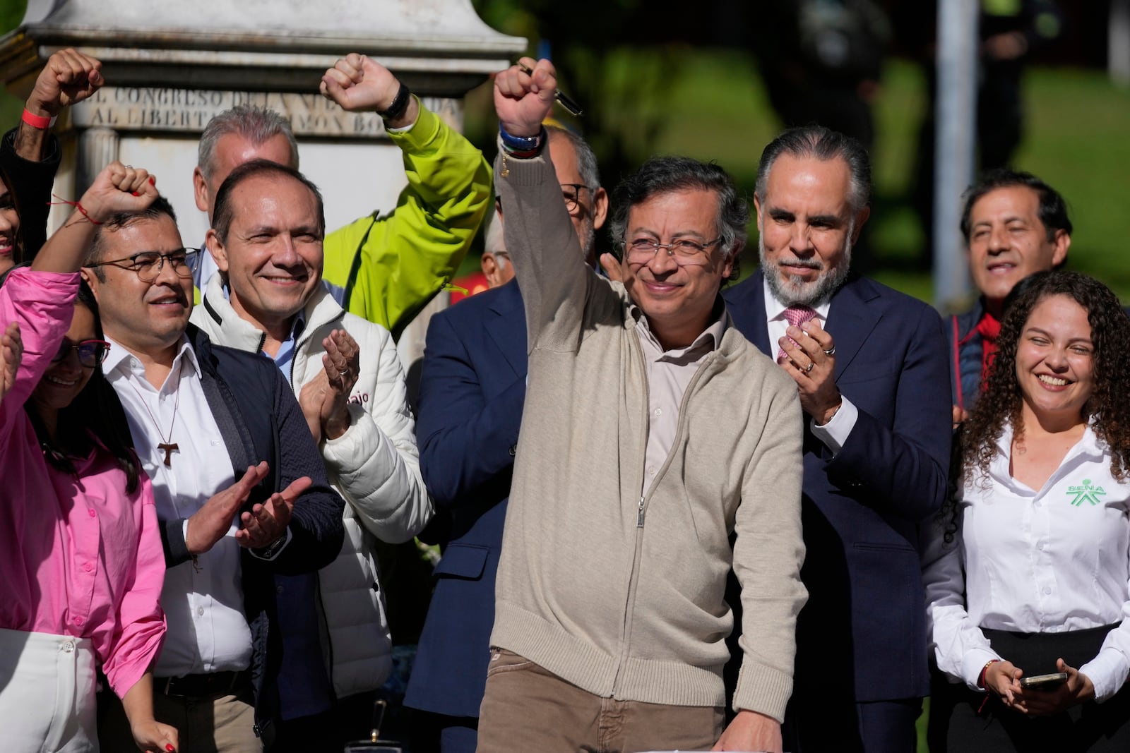 Colombia's President Gustavo Petro raises a fist before signing a labor reform bill into law in Bogota, Colombia, Wednesday, June 25, 2025. (AP Photo/Fernando Vergara)