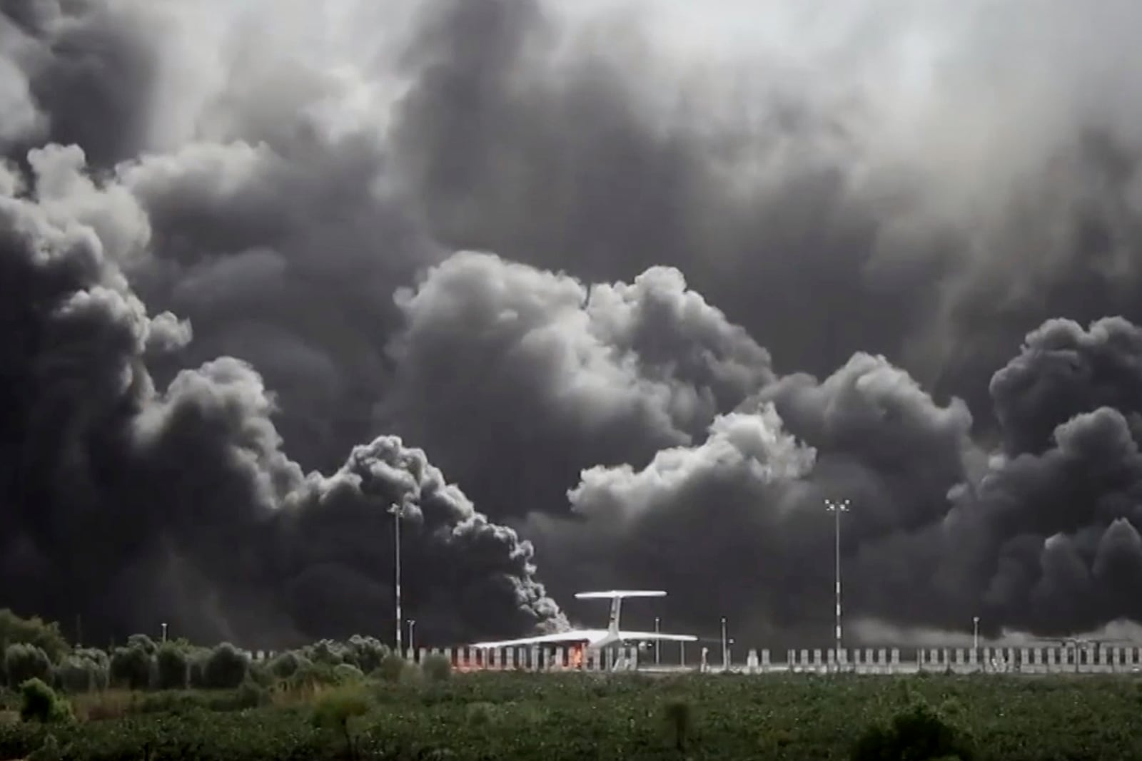 This frame grab from a handout video provided by the Ansar Allah Media Office shows smoke billowing from civilian aircraft following Israeli airstrikes on Sanaa International Airport in Sanaa, Yemen, Tuesday, May 6, 2025.(Courtesy of Ansar Allah Media Office via AP)