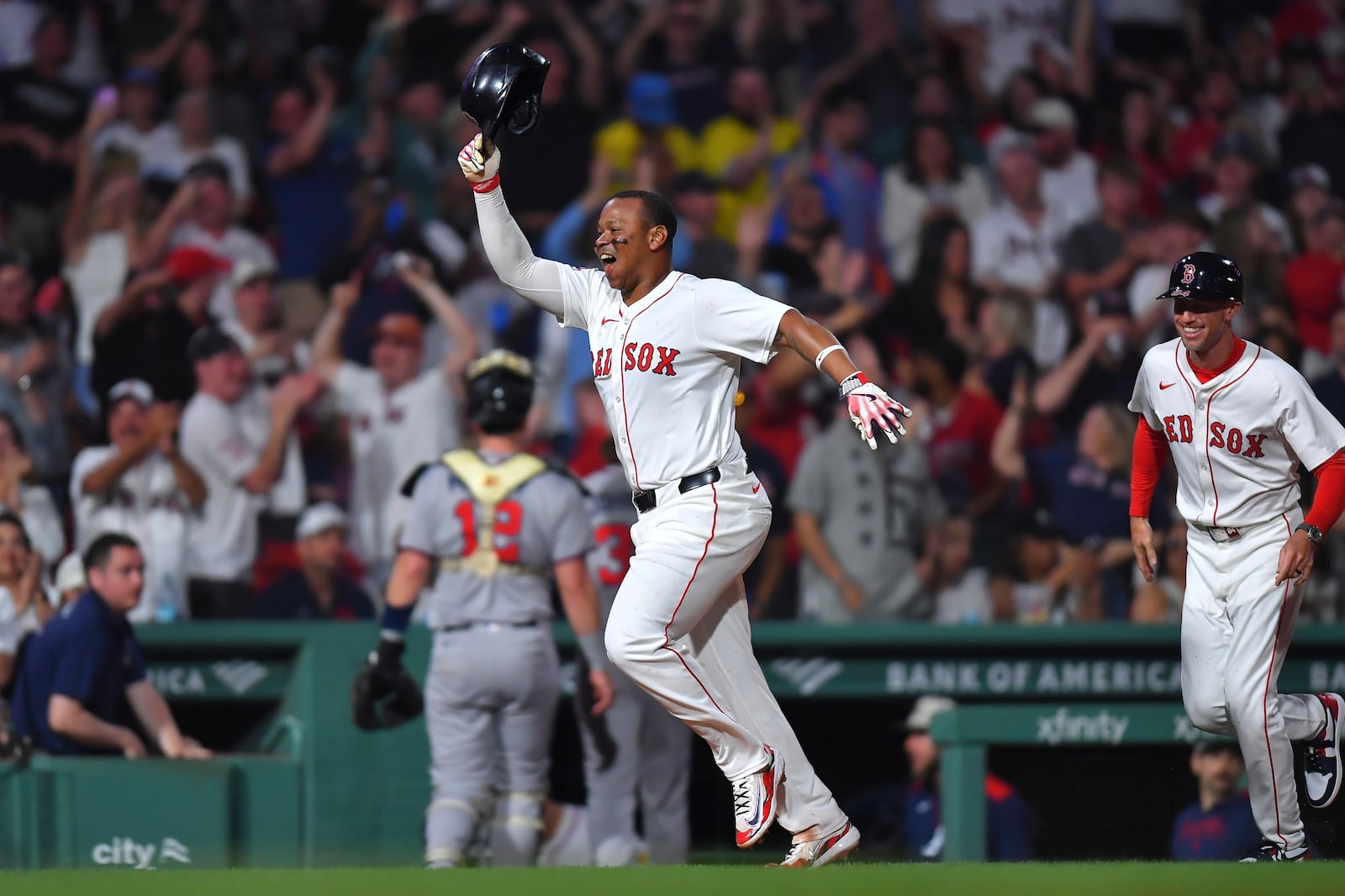 Boston Red Sox's Rafael Devers, left, celebrates as he runs the bases toward home after hitting a walkoff home run in the ninth inning of a baseball game against the Atlanta Braves, Saturday, May 17, 2025, in Boston. (AP Photo/Steven Senne)