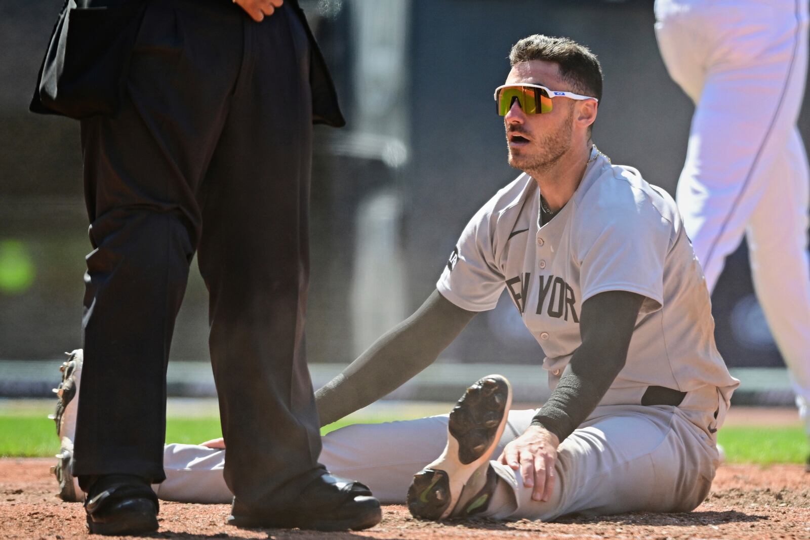 New York Yankees' Cody Bellinger reacts after being tagged out at home by Cleveland Guardians catcher Austin Hedges during the sixth inning of a baseball game, Wednesday, April 23, 2025, in Cleveland. (AP Photo/David Dermer)