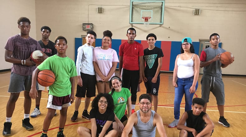 Pastor Armando Rodriguez from Iglesia Cristiana Adulum and a group of summer camp participants play basketball every Monday at the Robert “Sonny” Hall, Jr. Community Center, 800 Lafayette Ave. The center is operated by the Community Building Institute Middletown, a local nonprofit organization which provides cradle to career programming. Middletown City Council recently approved a new contract to operate the center. RICK MCCRABB/STAFF