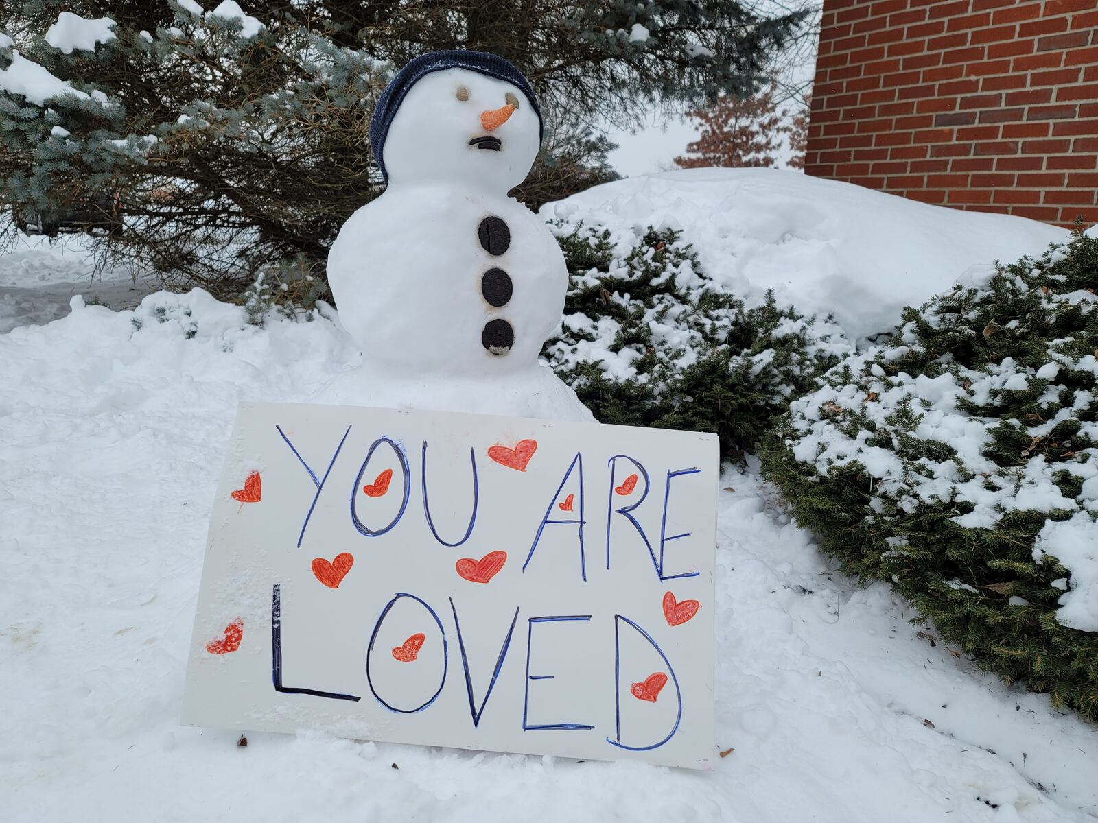 Local children built snowmen Tuesday at The Woodlands of Hamilton assisted living and memory-care live-in community. NICK GRAHAM / STAFF
