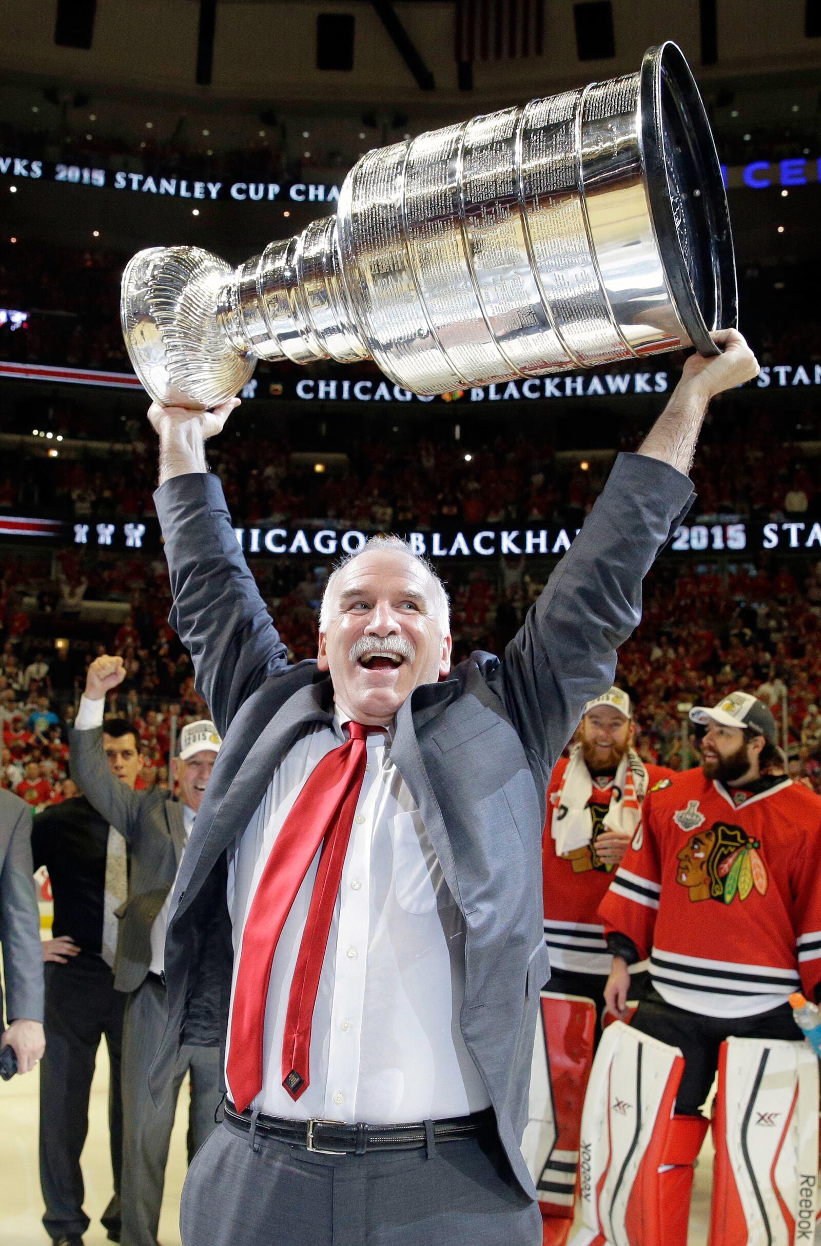 FILE - Chicago Blackhawks' head coach Joel Quenneville hoists the Stanley Cup after defeating the Tampa Bay Lightning in Game 6 of the NHL hockey Stanley Cup Final series on Wednesday, June 10, 2015, in Chicago. (AP Photo/Nam Y. Huh, File)