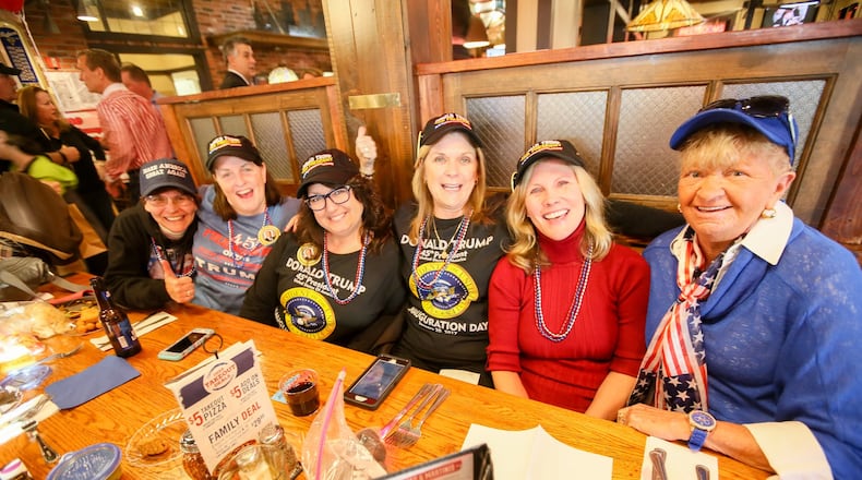 Trump for President campaign volunteers Eileen Barrick, Debbie Seiler, Terry Lewis, Terri Piening, Mary Sue Krummen, and Maureen Sollberger gather during an inauguration celebration Friday night in West Chester Twp. GREG LYNCH / STAFF