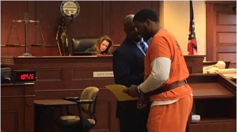 Broderick Malik Jones Roberts talks with his attorney David Washington during his arraignment Thursday in Butler County Common Pleas Court. LAUREN PACK/STAFF
