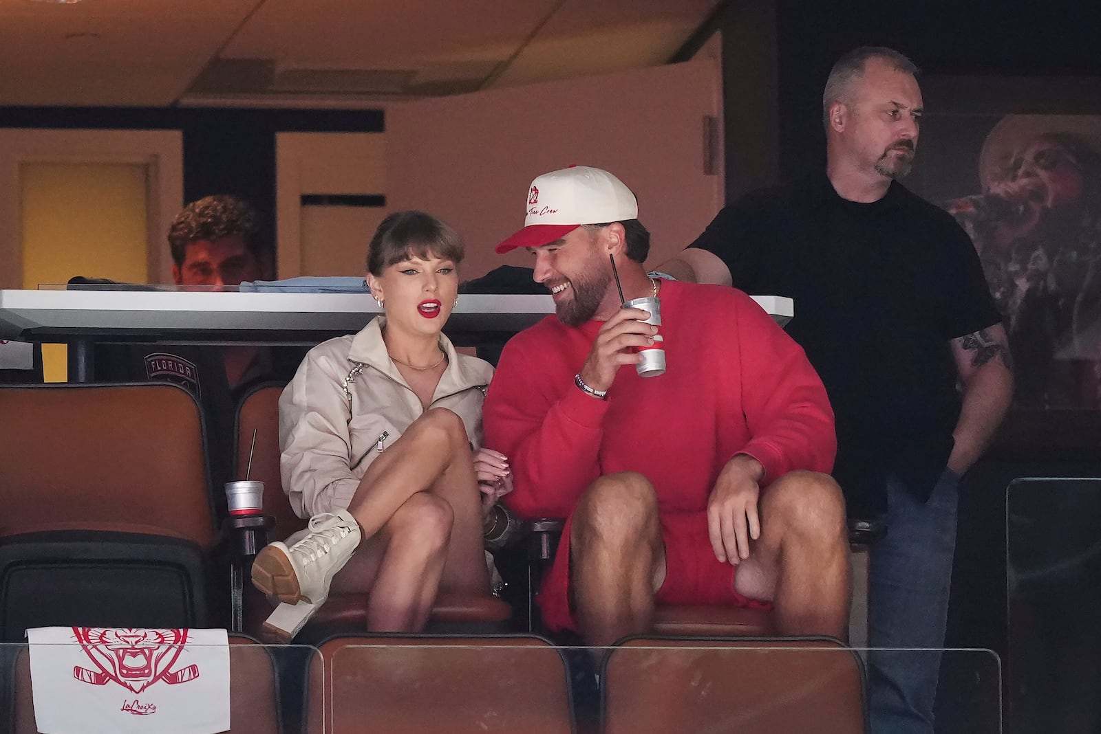 Singer Taylor Swift, front left, and Kansas City Chiefs football player Travis Kelce, front right, take in the third period in Game 4 of the NHL hockey Stanley Cup Final between the Edmonton Oilers and the Florida Panthers in Sunrise, Fla., Thursday, June 12, 2025. (Nathan Denette/The Canadian Press via AP)