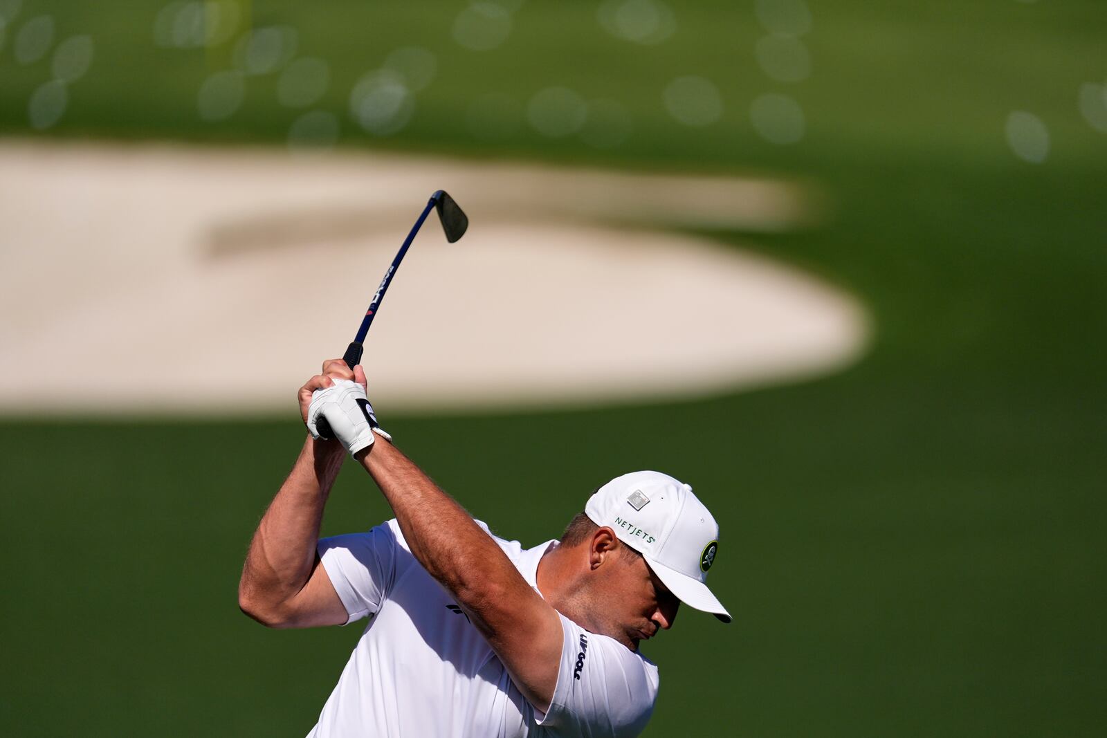Bryson DeChambeau hits from the driving range during a practice round at the Masters golf tournament, Tuesday, April 8, 2025, in Augusta, Ga. (AP Photo/George Walker IV)