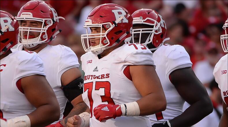 LINCOLN, NE - SEPTEMBER 23: Offensive lineman Dorian Miller #60 of the Rutgers Scarlet Knights and offensive lineman Jonah Jackson #73 and offensive lineman Michael Maietti #55 lead the team on the field against the Nebraska Cornhuskers at Memorial Stadium on September 23, 2017 in Lincoln, Nebraska. (Photo by Steven Branscombe/Getty Images)