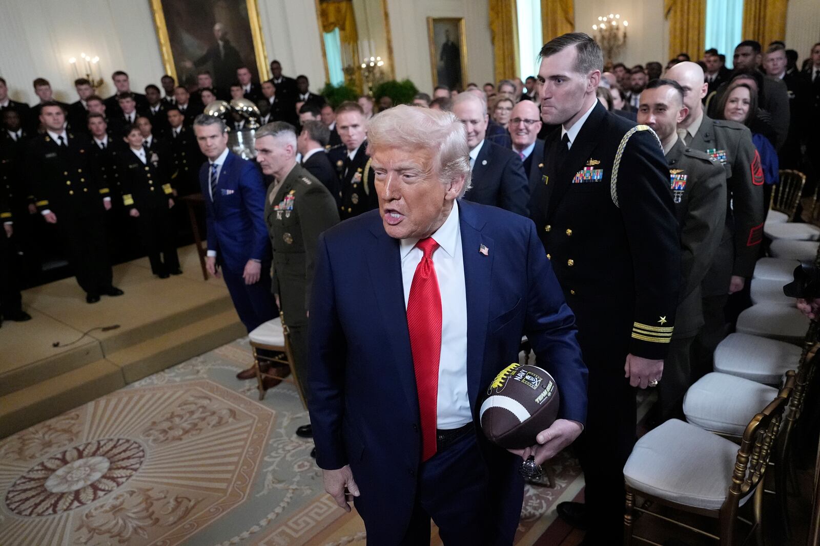 President Donald Trump departs the Commander-in-Chief trophy presentation to with the Navy Midshipman football team in the East Room of the White House, Tuesday, April 15, 2025, in Washington. (AP Photo/Alex Brandon)