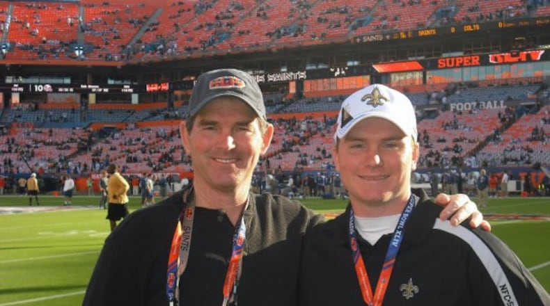 Bengals defensive coordinator Mike Zimmer (left) with his son Adam when they both coached with the Bengals. FILE PHOTO