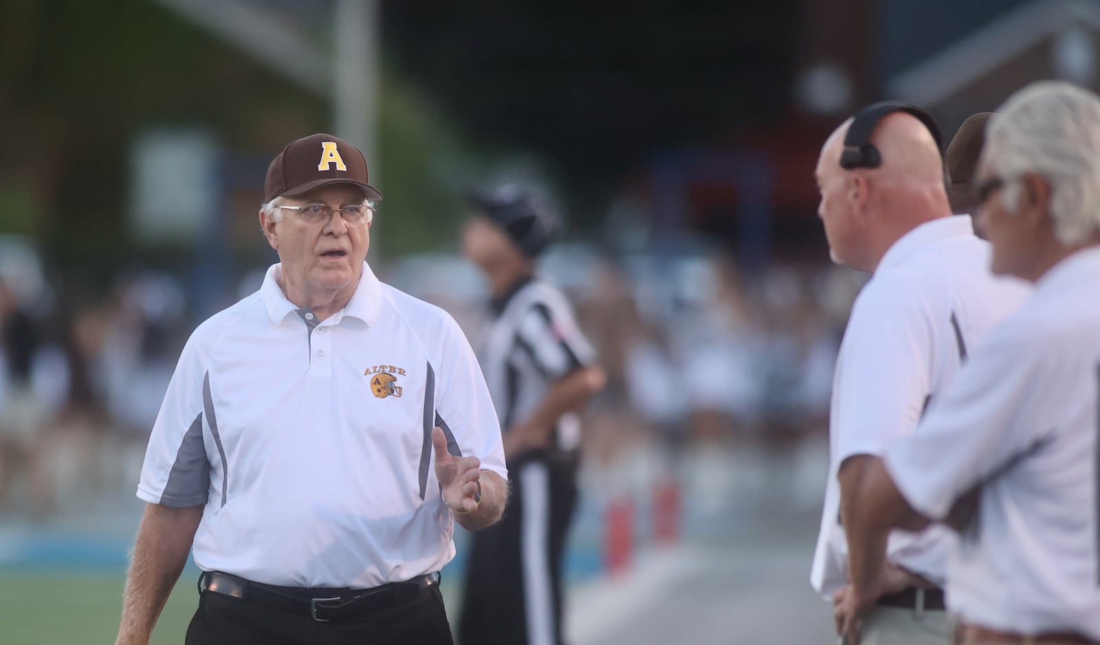 Alter's Ed Domsitz coaches during a game against Trotwood-Madison on Friday, Sept. 12, 2025, at Roush Stadium in Kettering. David Jablonski/Staff