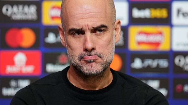 Manchester City manager Pep Guardiola looks on during a press conference in Manchester, England, Tuesday Jan. 27, 2026, one day ahead of their Champions League soccer match against Galatasaray. (Martin Rickett/PA via AP)