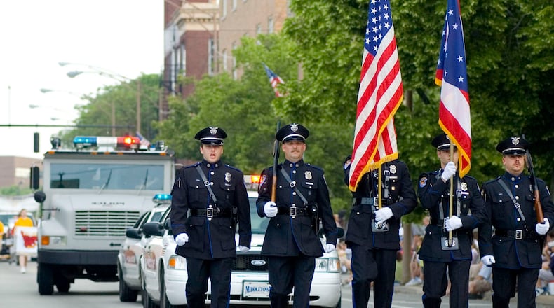 The Middletown Police Department Color Guard travels down Verity Parkway during a past Memorial Day parade. This year's parade, set to step off at 10 a.m. Monday, will travel from Smith Park to Woodside Cemetery where a memorial service will be held. FILE PHOTO  
NICHOLAS S. GRAHAM
