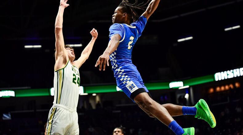 Hamilton’s Andrea Holden slams one home over Sycamore’s Raleigh Burgess on Sunday night at Xavier University’s Cintas Center. Kyle Hendrix/CONTRIBUTED