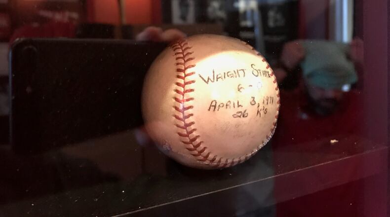 The baseball Buddy Schultz used in his NCAA record game 50 years ago. On April 3, 1971, the Miami left hander struck out 26 Wright State batters in a nine inning game. The record still stands today. The ball is now displayed, alongside a large photo of Buddy in the Toby K. Schultz Heritage Hallway inside the Jay Hayden Baseball Center on the Miami University campus. Tom Archdeacon/STAFF