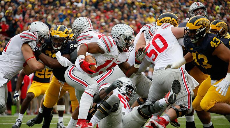ANN ARBOR, MI - NOVEMBER 28: Running back Ezekiel Elliott #15 of the Ohio State Buckeyes carries the ball against the Michigan Wolverines in the first half at Michigan Stadium on November 28, 2015 in Ann Arbor, Michigan. (Photo by Gregory Shamus/Getty Images)