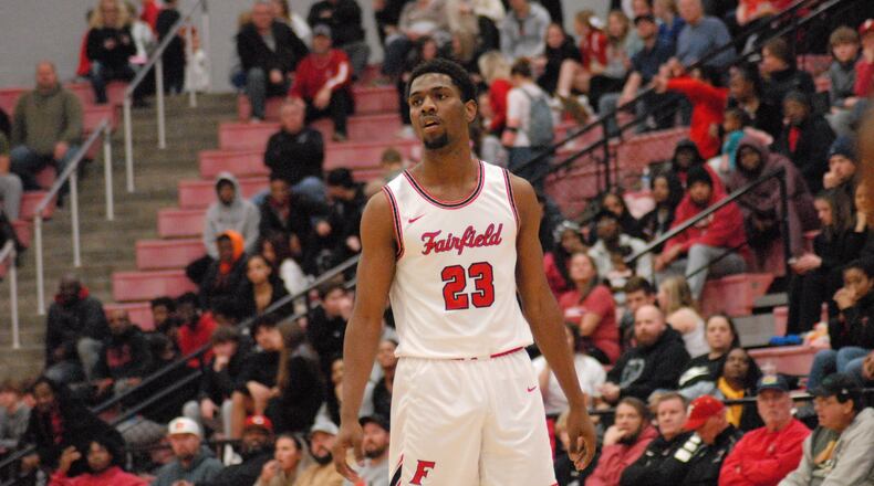 Fairfield's Mason King surveys the court against Sycamore on Friday night at Fairfield Arena. Chris Vogt/CONTRIBUTED