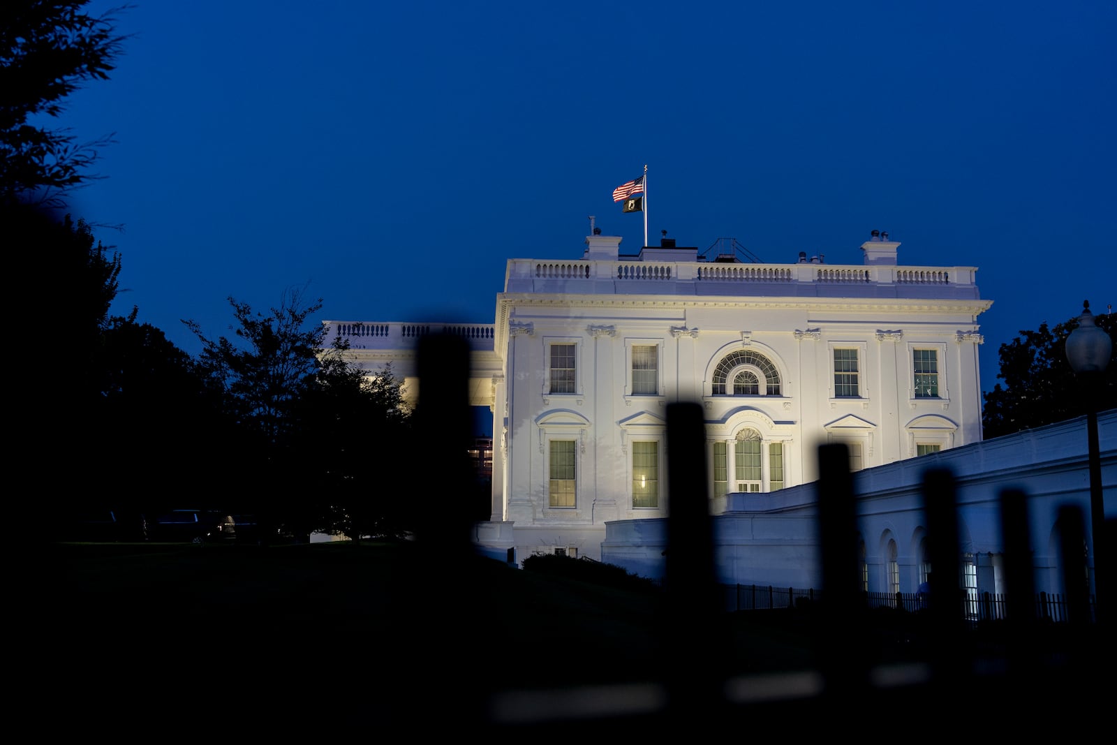 The White House is illuminated, Saturday, June 21, 2025, in Washington. (AP Photo/Alex Brandon)