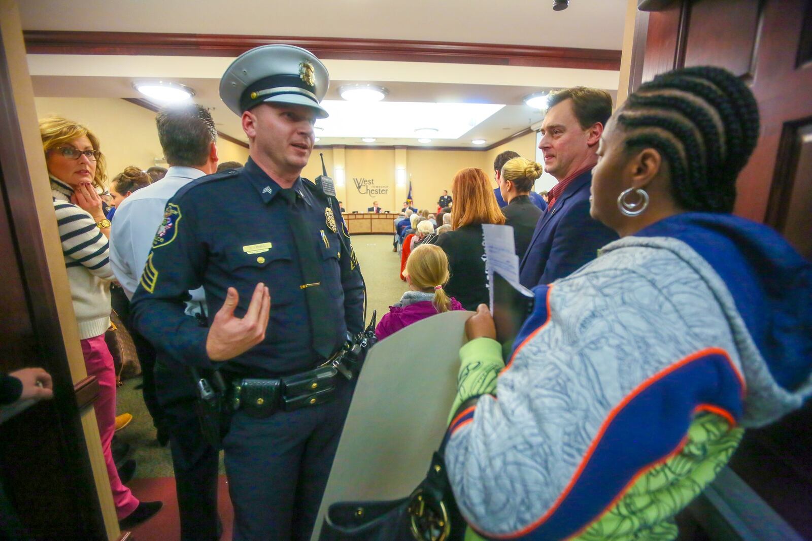 Dozens of union workers and West Chester residents, including Jasmine Williams, crowded the West Chester Twp. Administration building for the Board of Trustees meeting, Tuesday, Jan. 24, 2017. GREG LYNCH / STAFF