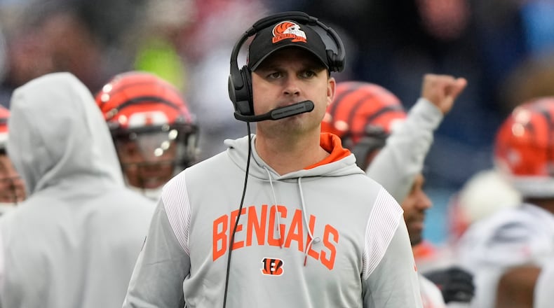 Cincinnati Bengals head coach Zac Taylor walks the sidelines during the second half of an NFL football game against the Tennessee Titans, Sunday, Nov. 27, 2022, in Nashville, Tenn. (AP Photo/Gerald Herbert)