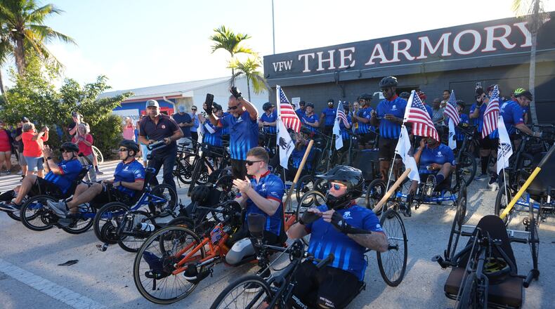 Wounded veterans prepare to start their ride in the annual Florida Keys Soldier Ride organized by the Wounded Warrior Project, Friday, Jan. 9, 2026, in Key Largo, Fla. (AP Photo/Lynne Sladky)