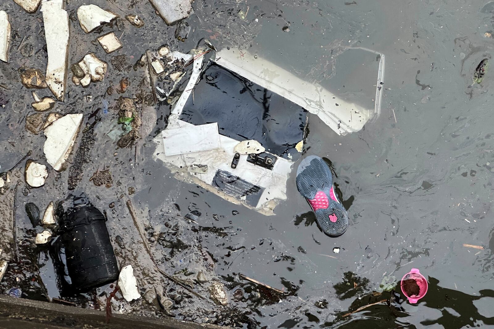 Debris floats in the water at the scene where a helicopter crashed into the Hudson River, Thursday, April 10, 2025, in Jersey City, N.J. (AP Photo/Ted Shaffrey)