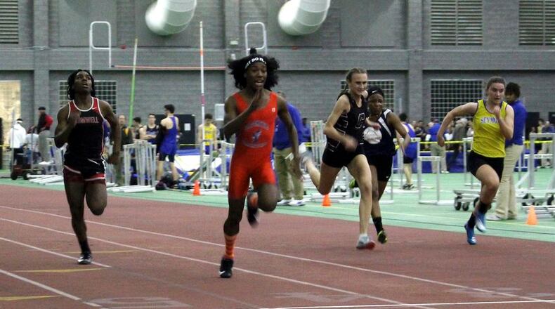 In this Thursday, Feb. 7, 2019 photo, Bloomfield High School transgender athlete Terry Miller, second from left, wins the final of the 55-meter dash over transgender athlete Andraya Yearwood, left, and other runners in the Connecticut girls Class S indoor track meet at Hillhouse High School in New Haven, Conn. In the track-and-field community in Connecticut, the dominance of Miller and Yearwood has stirred resentment among some competitors and their families. (AP Photo/Pat Eaton-Robb)