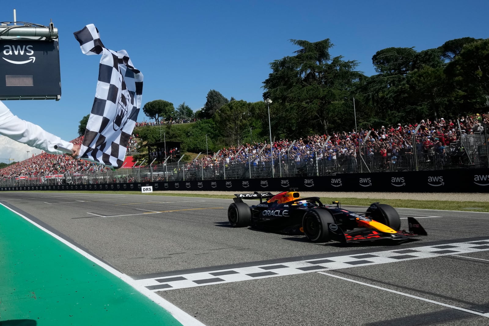 Red Bull driver Max Verstappen of the Netherlands crosses the finish line to win the Italian Emilia Romagna Formula One Grand Prix, at the Enzo and Dino Ferrari racetrack in Imola, Italy, Sunday, May 18, 2025. (AP Photo/Luca Bruno, Pool)