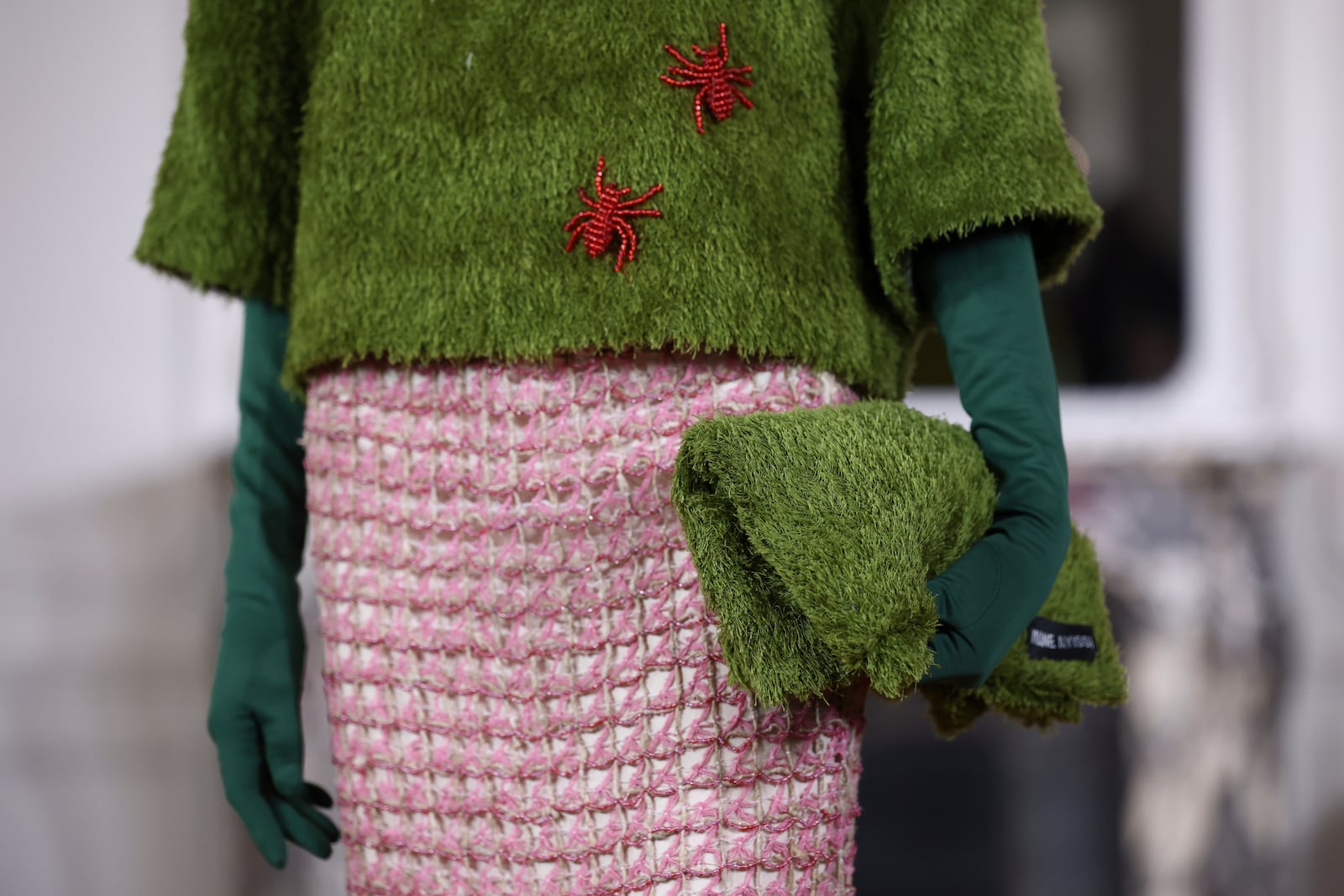 A model wears a creation as part of the Imane Ayissi Fall-Winter 2025/26 Haute Couture collection presented Monday, July 7, 2025, in Paris. (AP Photo/Tom Nicholson)