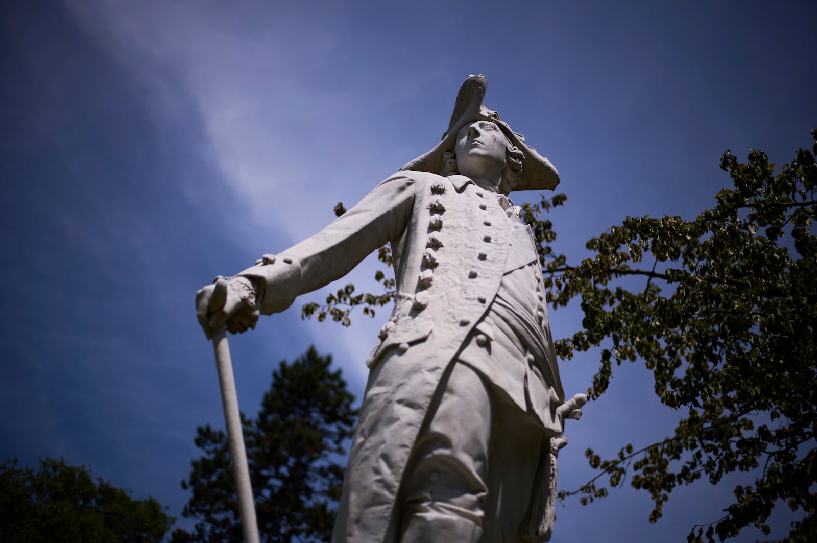 A statue of King Frederick II of Prussia stands in the park of Sanssouci Palace in Potsdam, Germany, June 17, 2025. (AP Photo/Markus Schreiber)