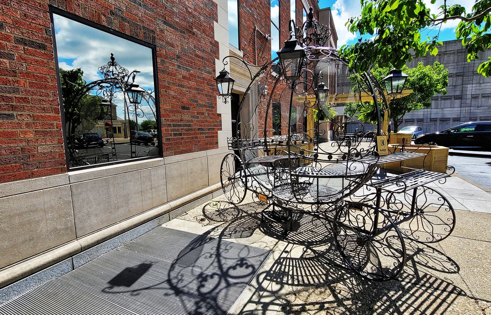 The Benison event center in Hamilton has added flower planters for an outdoor seating area and a metal carriage with the help of students from the Butler Tech carpentry program at Hamilton High School and Butler Tech welding students. NICK GRAHAM / STAFF