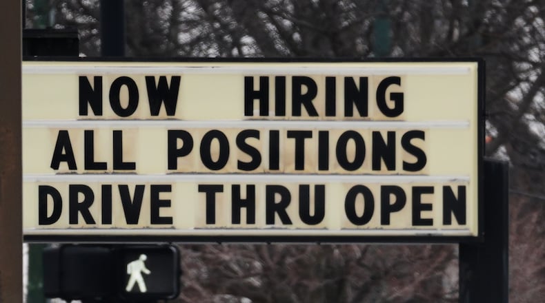 Hiring sign is displayed in front of a restaurant in Chicago, Thursday, Feb. 5, 2026. (AP Photo/Nam Y. Huh)
