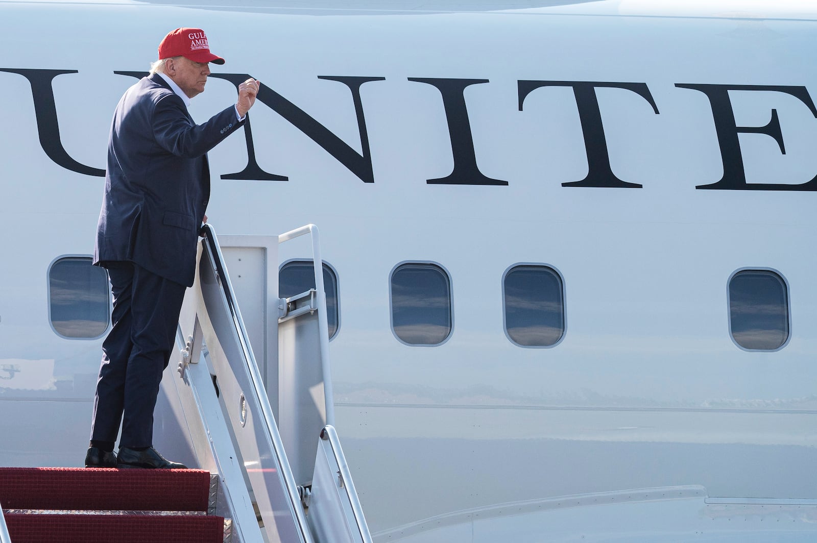 President Donald Trump waves as he boards Air Force One at Joint Base Andrews, Md., Tuesday, July 1, 2025, for a trip to visit a new migrant detention center in Ochopee, Fla. (AP Photo/Cliff Owen)