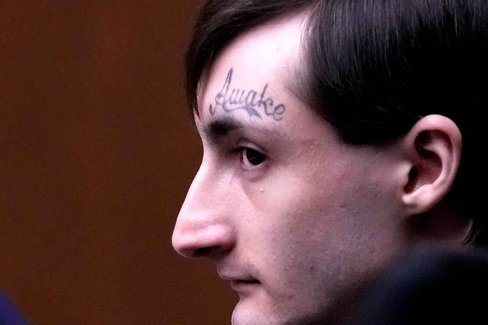 FILE - Robert E. Crimo III watches the jury selection process during the first day of his trial, accused of opening fire on a suburban Chicago Independence Day parade, killing seven people, at the Lake County Courthouse, Waukegan, Ill., Feb. 24, 2025. (AP Photo/Nam Y. Huh, Pool, File)
