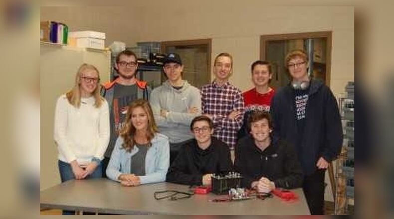Some of Fairfield High School’s Samsung contest team (sitting left to right): Katarina Putnick, leader, project administration team; Alex Quedens, leader, software team; Jack Biondo, leader, hardware team; and standing from left to right are Megan Barth, Bryce Behr, Ryan Brown, Jared Cusick, Jackson Cowan, Michael Ryan. The team won top honors in Ohio for their science project and now are competing for a national title and $100,000 in STEM equipment.