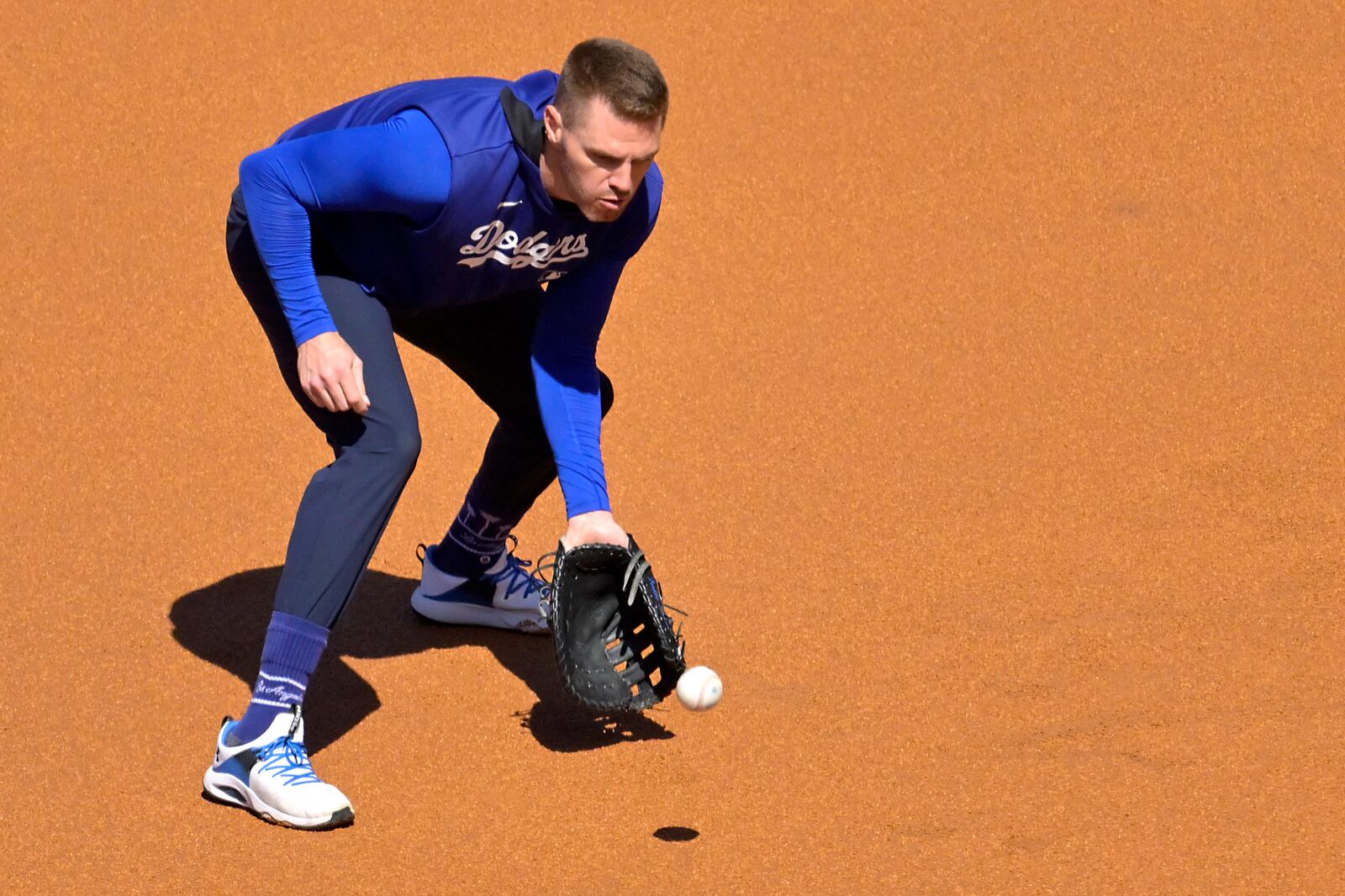 Los Angeles Dodgers first baseman Freddie Freeman warms up prior to a baseball game against the Chicago Cubs, Friday, April 11, 2025, in Los Angeles. (AP Photo/Jayne Kamin-Oncea)