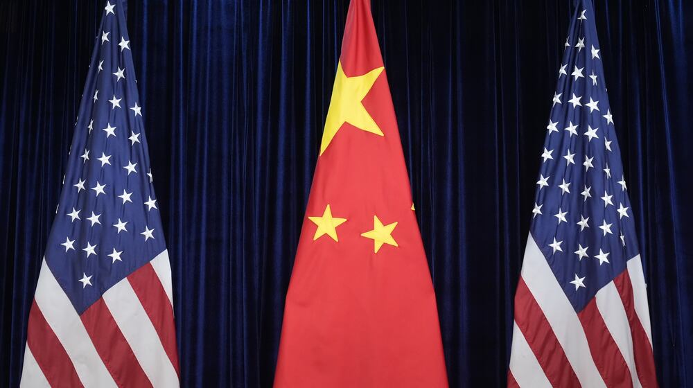 FILE - Flags of the U.S. and China are displayed at the Gimhae International Airport in Busan, South Korea, Oct. 30, 2025. (AP Photo/Mark Schiefelbein, File)