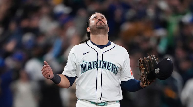 Seattle Mariners' Eugenio Suárez reacts after Game 5 of baseball's American League Championship Series against the Toronto Blue Jays, Friday, Oct. 17, 2025, in Seattle. (AP Photo/Lindsey Wasson)