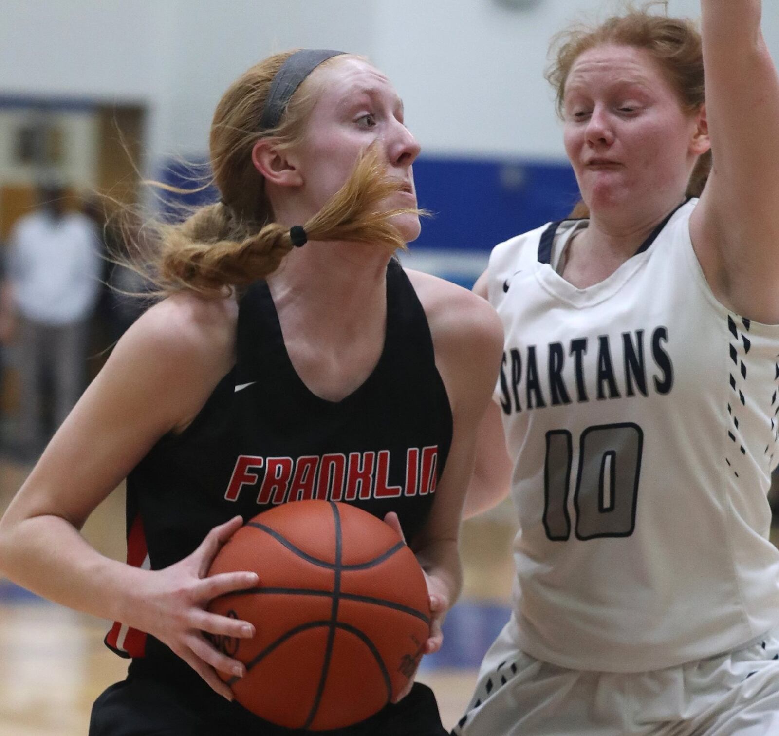 Franklin’s Jordan Rogers is defended by Valley View’s Abigail Dickson during Tuesday night’s Division II regional semifinal at Springfield. Franklin won 47-39 in overtime. BILL LACKEY/STAFF
