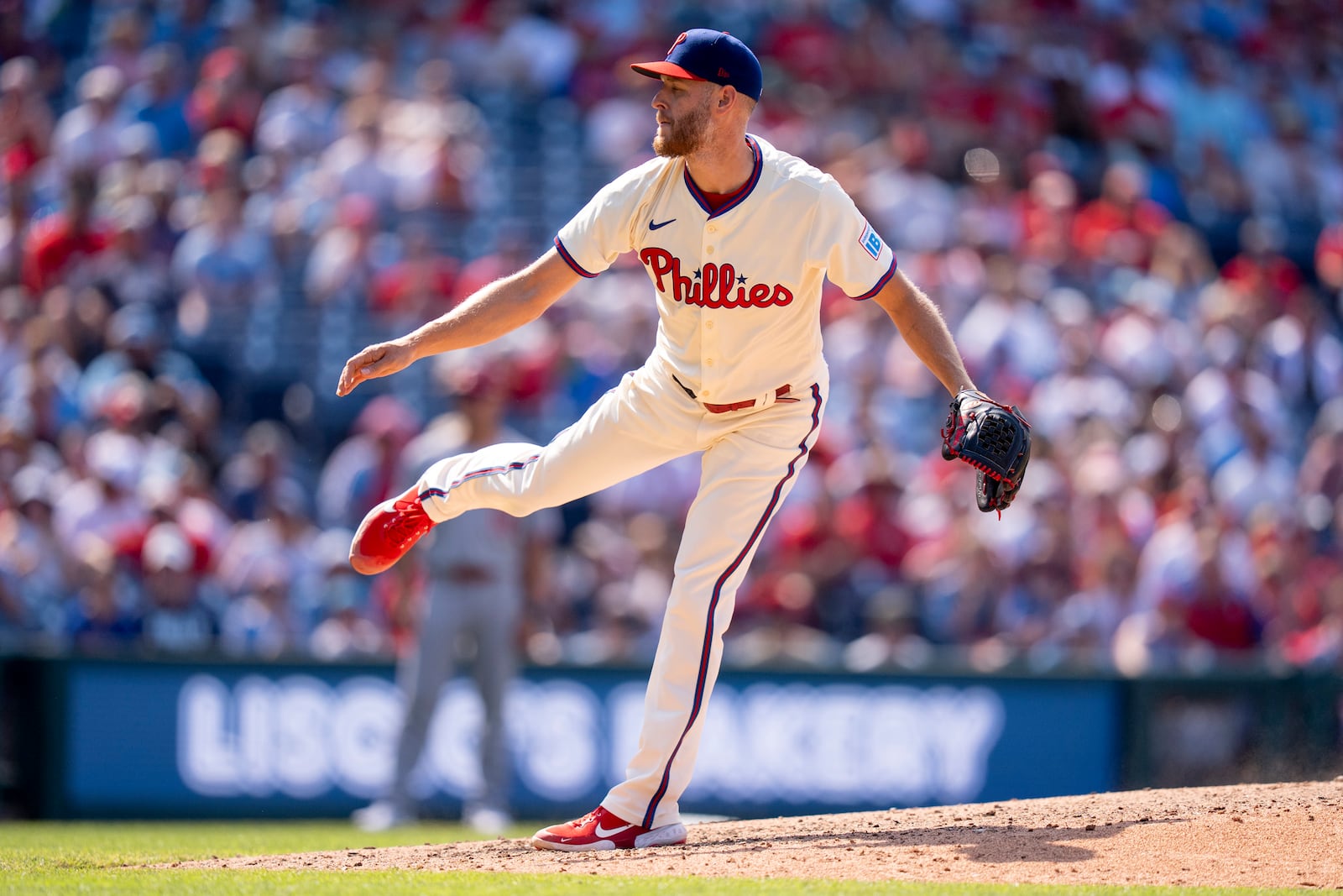 Philadelphia Phillies starting pitcher Zack Wheeler delivers during the ninth inning of a baseball game against the Cincinnati Reds, Sunday, July 6, 2025, in Philadelphia. (AP Photo/Chris Szagola)