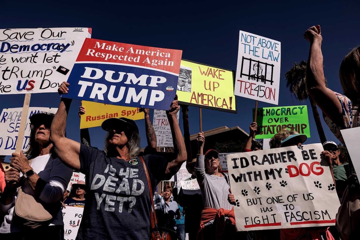 People attend a Hands Off protest against President Donald Trump and Elon Musk at the Arizona Capitol Lawn in Phoenix, Ariz., on Saturday, April 5, 2025. (Adriana Zehbrauskas/The New York Times)