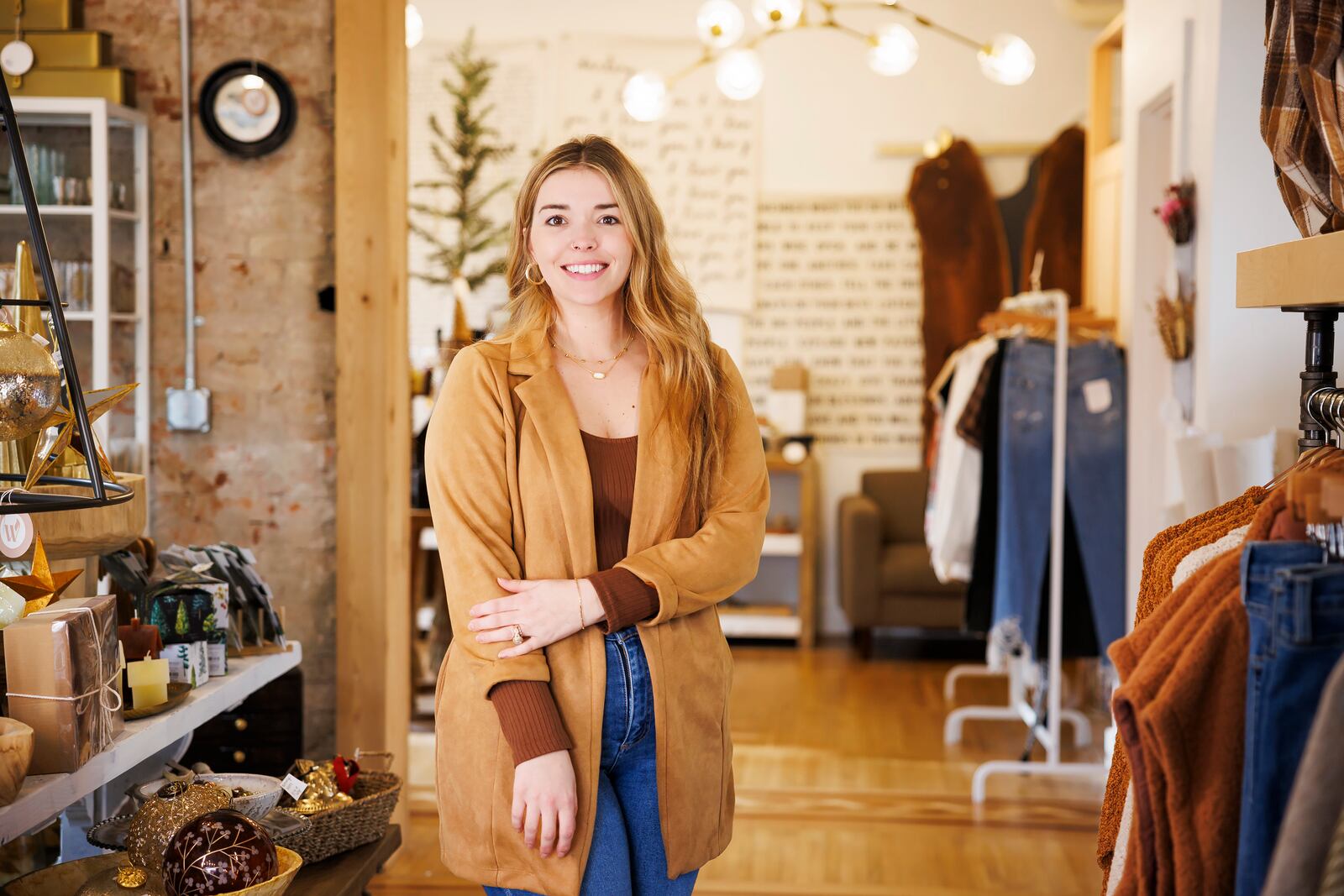 Sarah Dankoff, owner of Wildfire Hygge Goods, will close their High Street location by the end of the month and move inventory to their location around the corner at 127 N 2nd Street in Hamilton. NICK GRAHAM/STAFF 